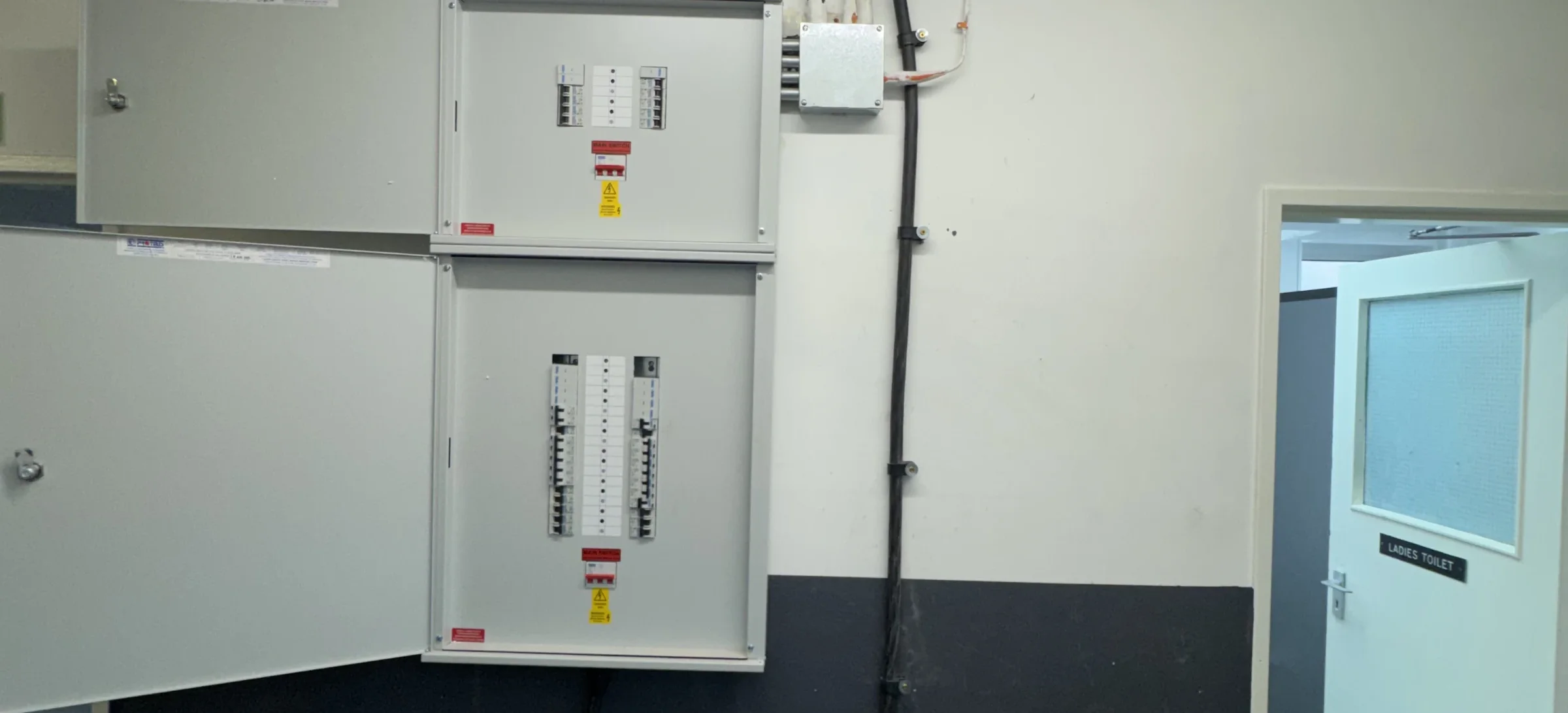 Completed installation: Completed essential and non-essential distribution boards with containment, local isolation and circuit identification.