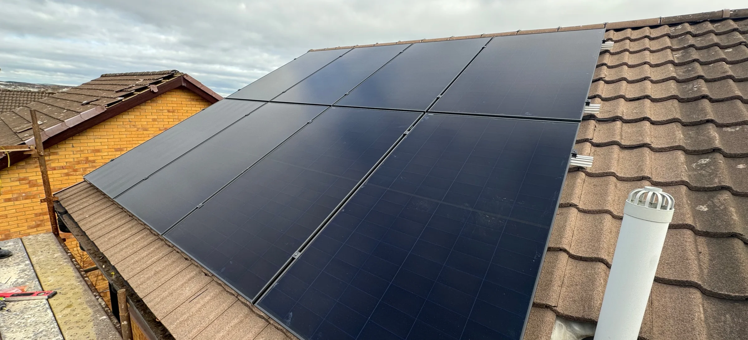 Completed PV array: Completed roof-mounted solar PV array following final alignment and installation.
